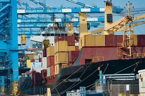 Abu Dhabi, United Arab Emirates. June 23rd 2019 
Shipping containers being unloaded from a container ship in Khalifa Port, Abu Dhabi, United Arab Emirates, GCC, Middle East.