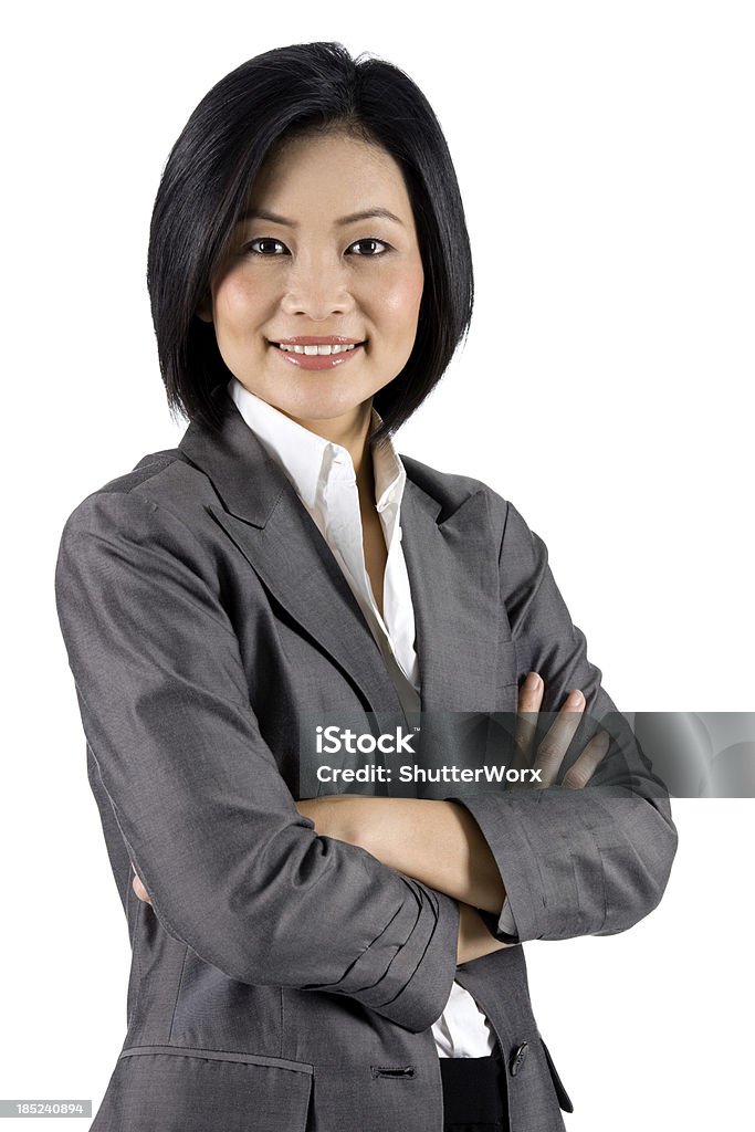 Contemporary Asian Businesswoman Modern Businessperson With Her Arms Folded. Singaporean Culture Stock Photo