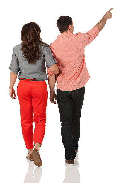 Rear view of a couple walking