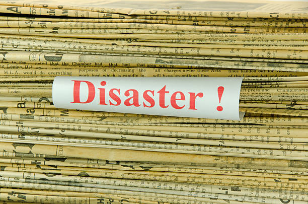 istock Stack of Yellowed Newspapers and Disaster 185241443