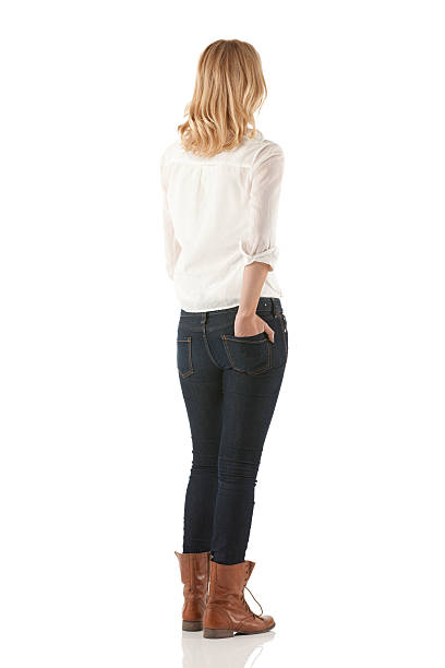 Woman standing with her hands in pockets