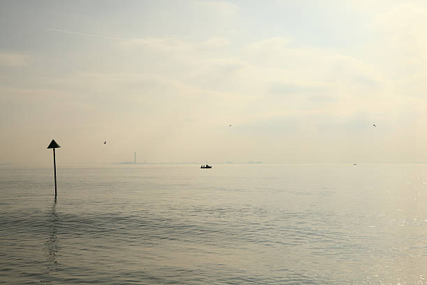 high key thames estuary spring heat haze looking towards Kent