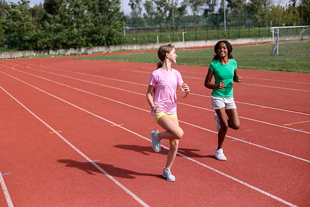 istock Girls running on a track 1852421247