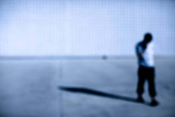 istock Soft focus sillhouette of a man covering face with hand 185242449