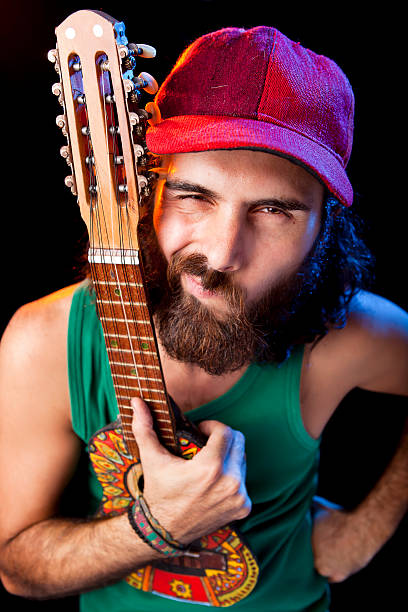 istock Musician playing small guitar at concert 185242450