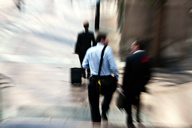 istock Businessmen Walking Downstairs, Carrying Briefcases, Blurred Motion, Docklands, London, England 185242529