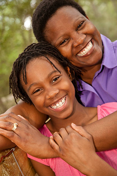 istock Happy laughing mother and daughter outside 185242972