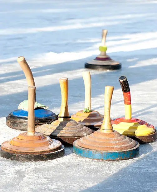 curling on ice outside