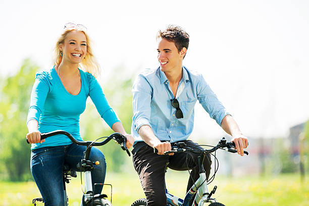 istock Beautiful young couple cycling. 185243399