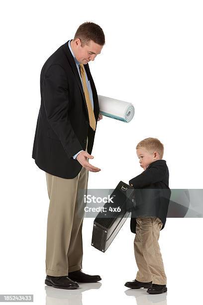 Son Giving Briefcase To His Father Stock Photo - Download Image Now - 30-39 Years, Adult, Blueprint