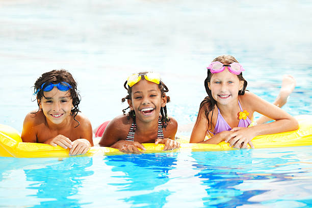 istock Happy diverse children in a pool 185243735