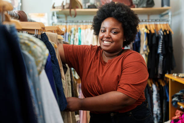 istock African American woman browsing for secondhand clothes inside thrift shop 1852442072