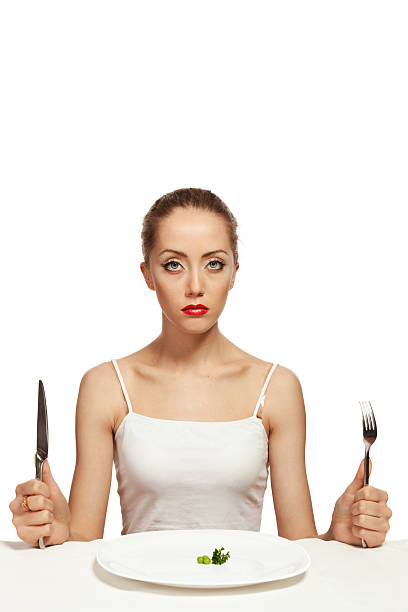 istock Hungry young woman on a diet 185244420