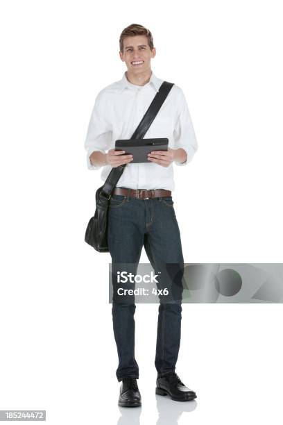 Man Holding An Electronic Organizer Stock Photo - Download Image Now - 20-29 Years, Adult, Adults Only