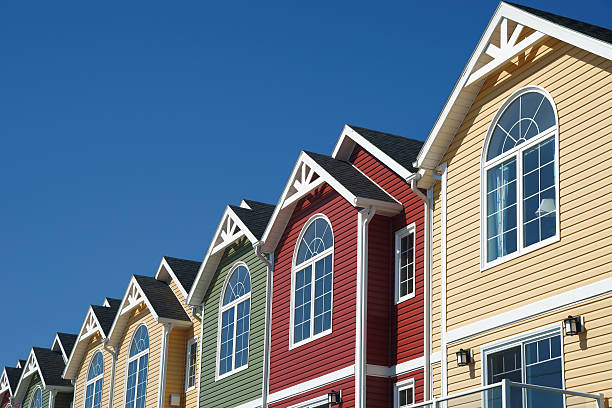 Brightly coloured town houses A newly constructed row of brightly coloured North American style town houses. Photographed in Summerside, Prince Edward Island, Canada. row house photos stock pictures, royalty-free photos & images