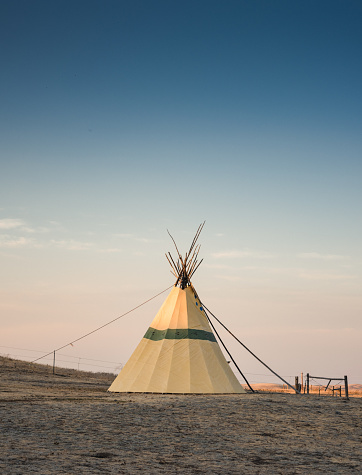 Calgary, Alberta, Canada. Jul 09, 2015. A tipi or tepee a conical lodge tent that is distinguished with smoke flaps at the top of the structure, and historically made of animal hides.