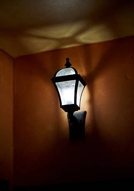 istock Illuminated lamp on corner of building 185244935