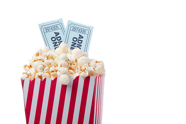 Red Striped Popcorn Bag And Movie Ticket On White Background