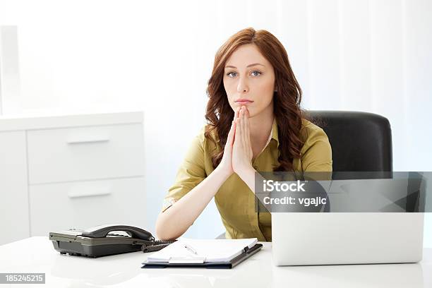 Exhausted Businesswoman Praying In The Office Stock Photo - Download Image Now - Office, One Woman Only, Women