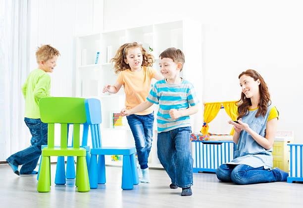 Preschool: Preschoolers Playing Musical Chairs.