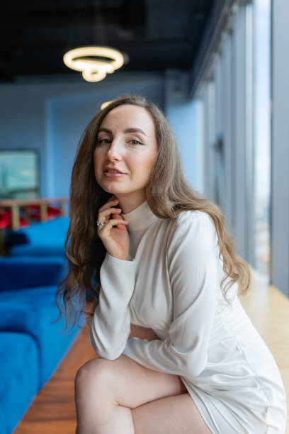 istock Manager sits next to panoramic window in coworking area 1852454371