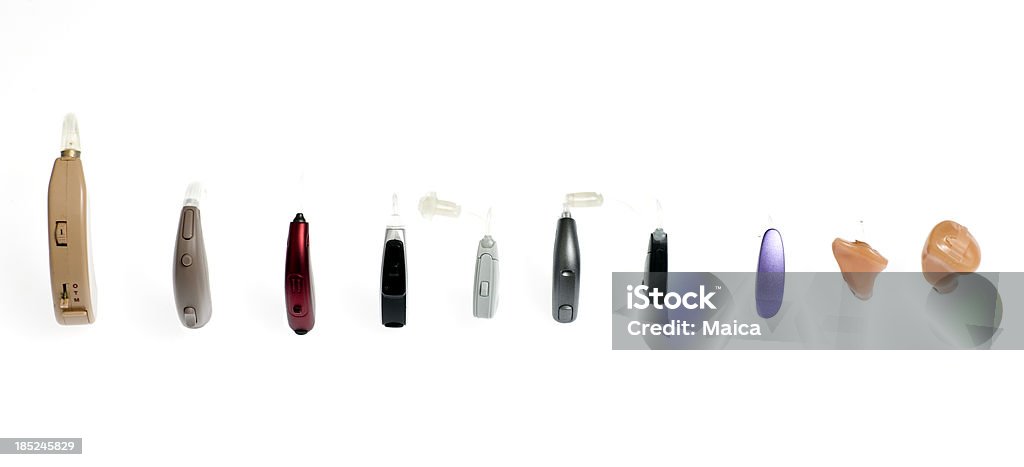 Hearing aids, different kinds Modern varied hearing aids models in a row. Hearing Aid Stock Photo