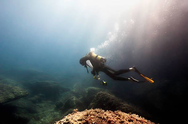 istock Scuba diver coming out of underwater cave 185246414