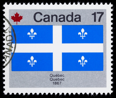 1979 Canada postage stamp with an image of the provincial flag of Quebec.