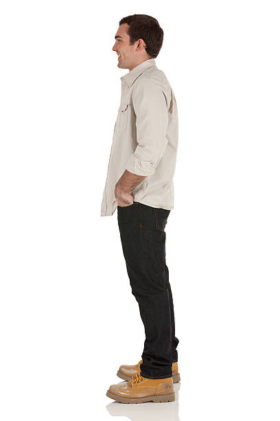 Happy Man Standing With His Hands In Pockets Stock Photo - Download Image  Now - Men, Profile View, Side View - iStock