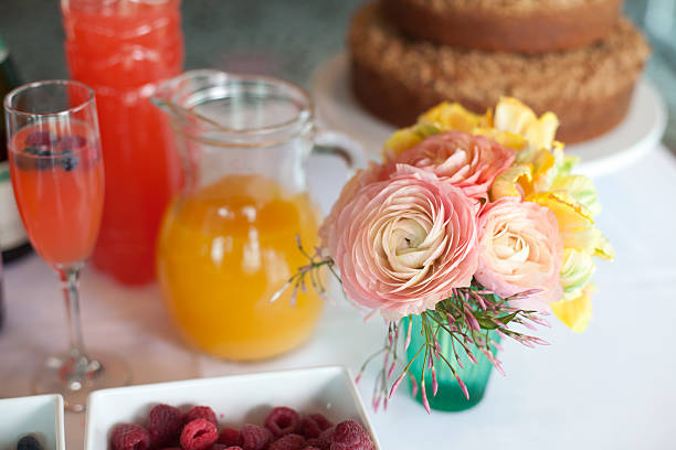 Pink flowers on a breakfast table stock photo