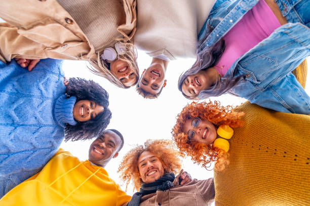istock Low angle view of multi-ethnic people forming a circle 1852479051