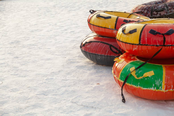 istock Several colored inflatable tubes on snow winter day on right 1852481678