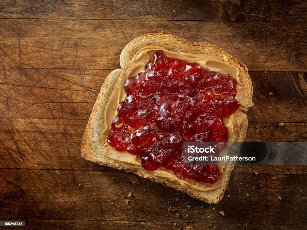 Peanut Butter and Jam Peanut Butter with Strawberry Jam on Toast- Photographed on Hasselblad H3D2-39mb Camera Peanut Butter And Jelly Sandwich Stock Photo