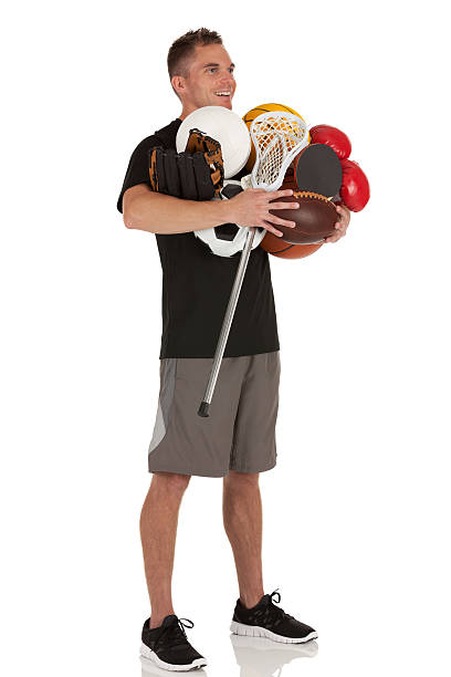 istock Man holding sports equiments 185248333
