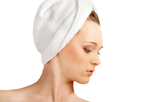 istock Beautiful Woman Face in a White Terry Towel. 185248620