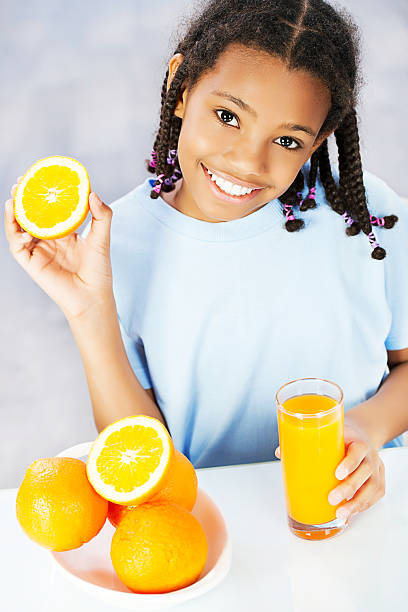 istock Little girl making juice. 185248645