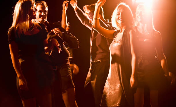 istock Group of young people dancing in nightclub 185248712