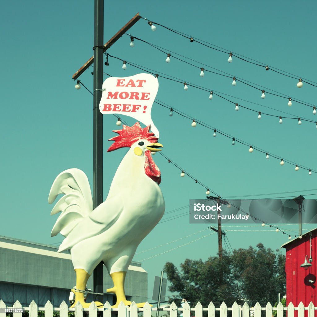 Chicken Says Eat Beef A generic plastic chicken to advertise a roadside diner in Southern California. Pastel colors, roadside diner, California, Sun, a giant talking chicken... just like the old days in the Wild West. Advertisement Stock Photo