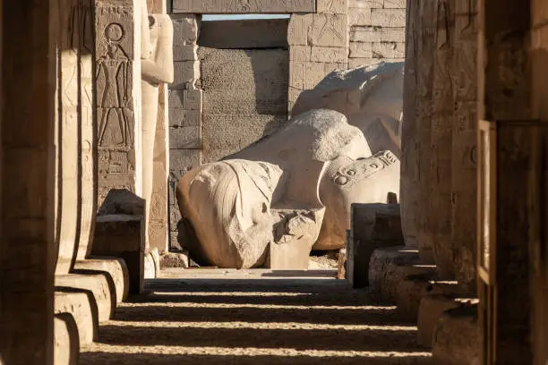 Part of a statue of the fallen Ozymandias Colossus, at the Ramesseum, a memorial temple  for Pharaoh Ramesses II, made famous by the poet Percy Bysshe Shelley. Located on the West bank of the River Nile, Luxor, Egypt.