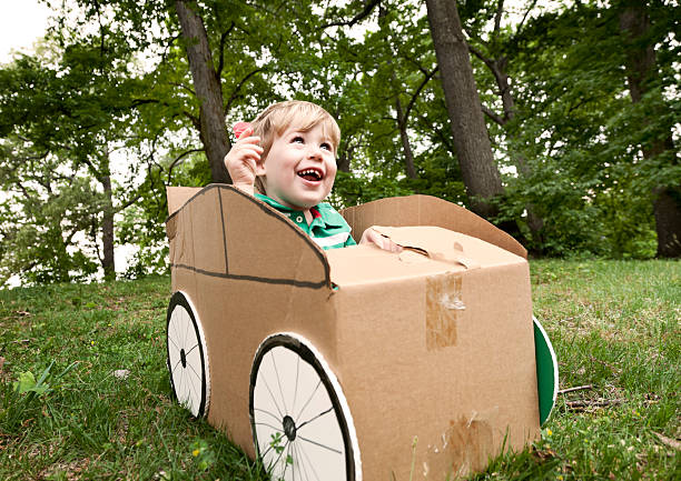 istock Little Boy in a Cardboard Car 185249371