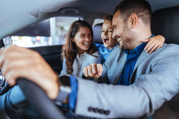 istock Happy family choosing new car 1852498313