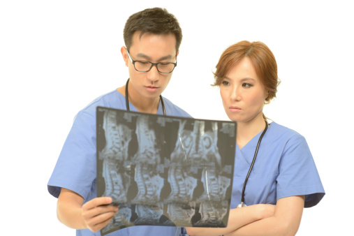 Medical doctors examining  MRI scan. Copy space. Selective focus. Downsized.Technical Details: Nikon D800. ISO 100.