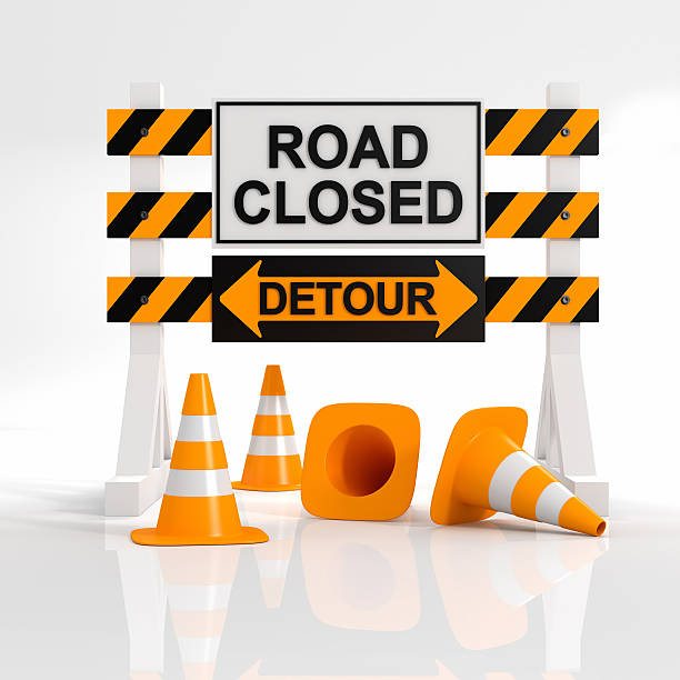 istock A sign showing that a road is closed with a detour sign 185249934