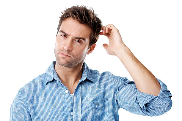 Wish you had a better memory? Handsome young man looking puzzled and scratching his head - isolated on white confusion raised eyebrows human face men stock pictures, royalty-free photos & images