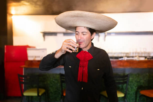 istock Stereotypical Mexican man sipping a caballito de tequila 1852499973