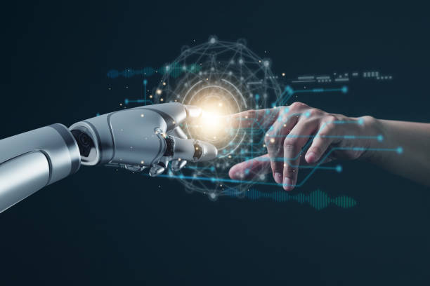 istock AI technology concept, Machine Learning, Robot hand touching human hand. to connect with global data refers to how humans can create and control artificial intelligence, AI innovation and technology. 1852501580