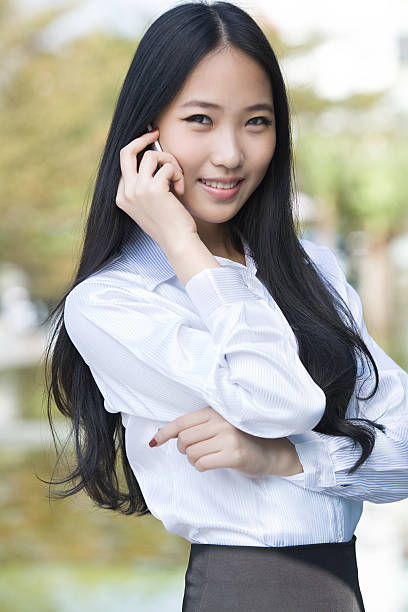 istock Smiling woman on the phone 185250165