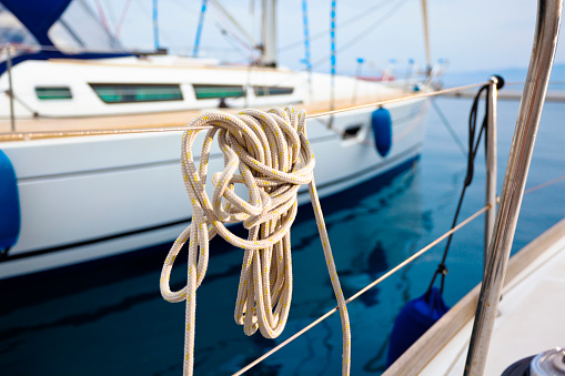 Rope on a yacht rail. Background is defocused.