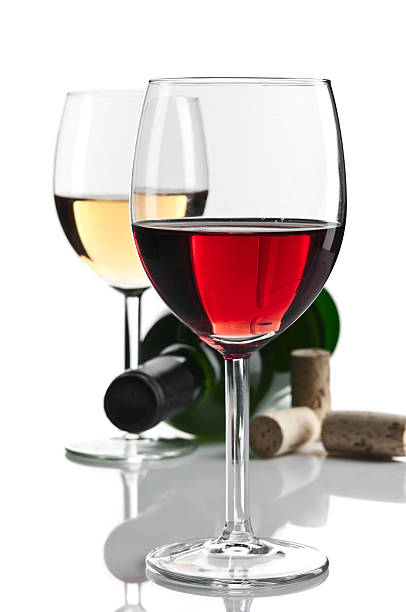 istock White and red wine glasses with bottle isolated 185250844