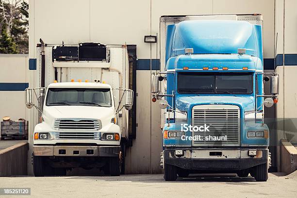 Tractor Trailers At Warehouse Stock Photo - Download Image Now - Loading Dock, Truck, Two Objects